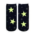Close-up showing the Starry Night Glow socks glowing in the dark; the white stars illuminate a bright, pale yellow-green.