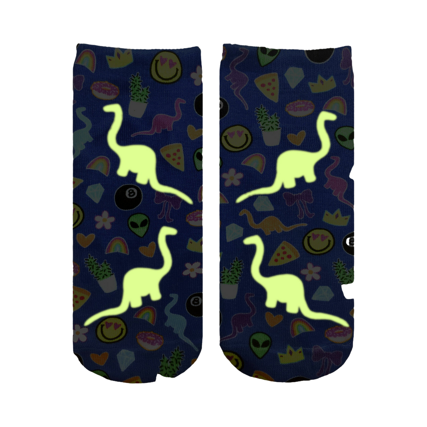 Close-up showing the Dino Madness Glow socks glowing in the dark; the dinosaurs and other elements are brightly illuminated against the blue background.