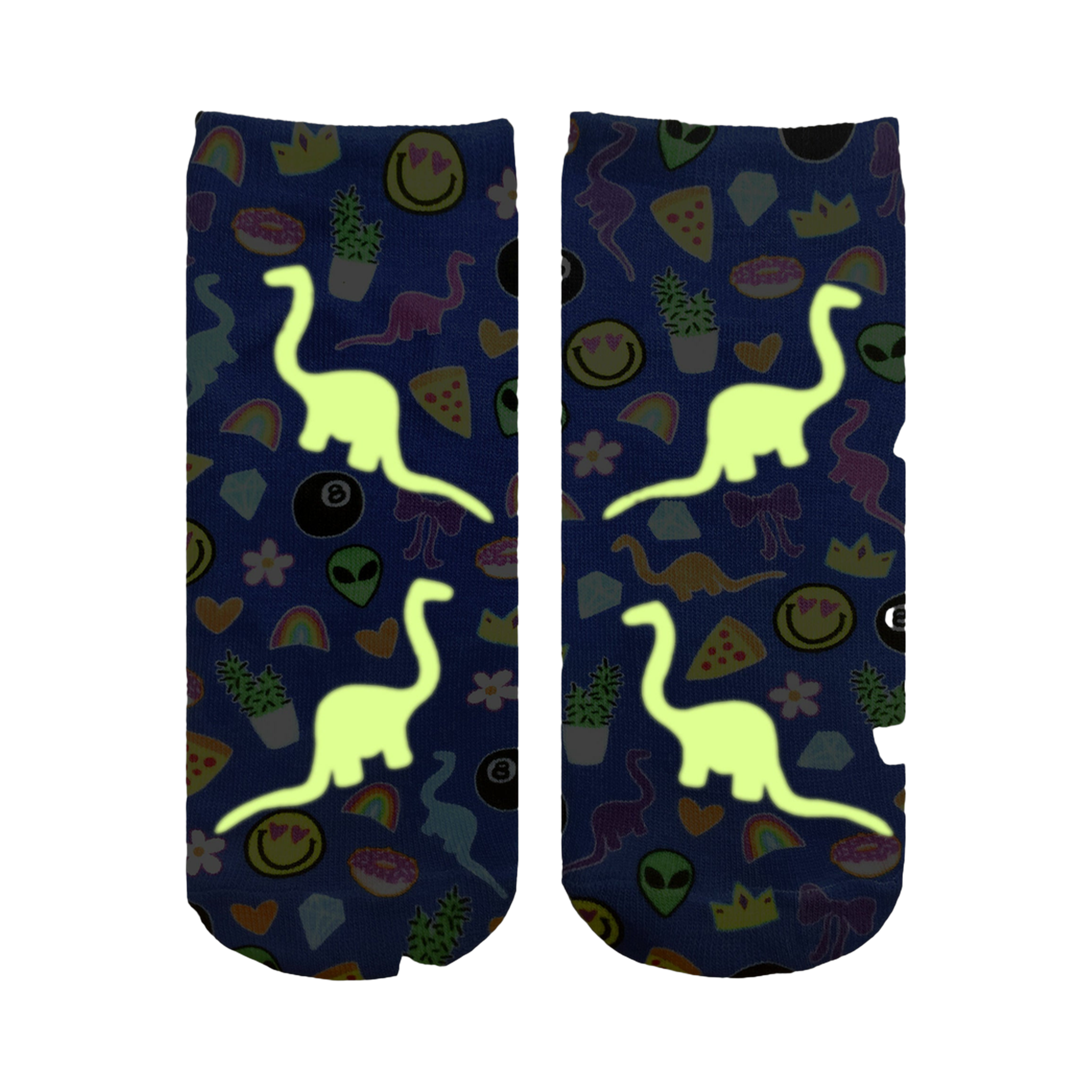 Close-up showing the Dino Madness Glow socks glowing in the dark; the dinosaurs and other elements are brightly illuminated against the blue background.
