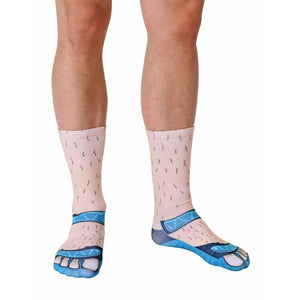 A pair of socks printed with the image of a pair of feet and blue sandals.
