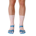 A pair of cream-colored crew socks depicting hairy legs wearing blue sandals.  Fun, novelty design. [lf]