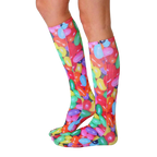 Lifestyle shot showing the Jelly Bean knee-high socks on a person's legs from the side. [lf]