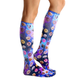 Lifestyle shot showing the Dog Cravings socks on a person's legs from the side; showcasing the fit and pattern. [lf]