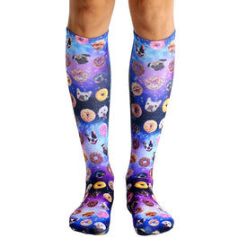 dog cravings knee-high socks in purple with a starry background and repeating photos of dogs and donuts. fits men and women.   