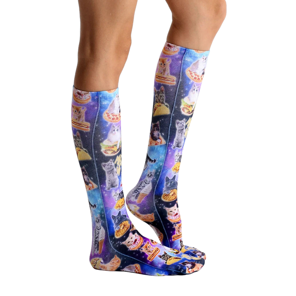 Lifestyle shot showing the socks on a person's legs, highlighting their length and the vibrant print. [lf]