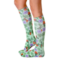 Lifestyle photo showing the Green Thumb socks on a woman's legs from the side. [lf]