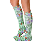 Lifestyle photo showing the Green Thumb socks on a woman's legs from the side. [lf]