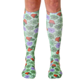 Pair of women's knee-high socks with a pastel green background and all-over print of succulents, cacti, and terracotta pots. [lf]