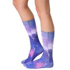 Lifestyle shot of a person wearing the Galaxy socks, showcasing how they look when worn. [lf]