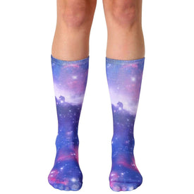 galaxy space socks for men and women featuring stars, clouds, and other celestial bodies in blue and purple on a black background.   