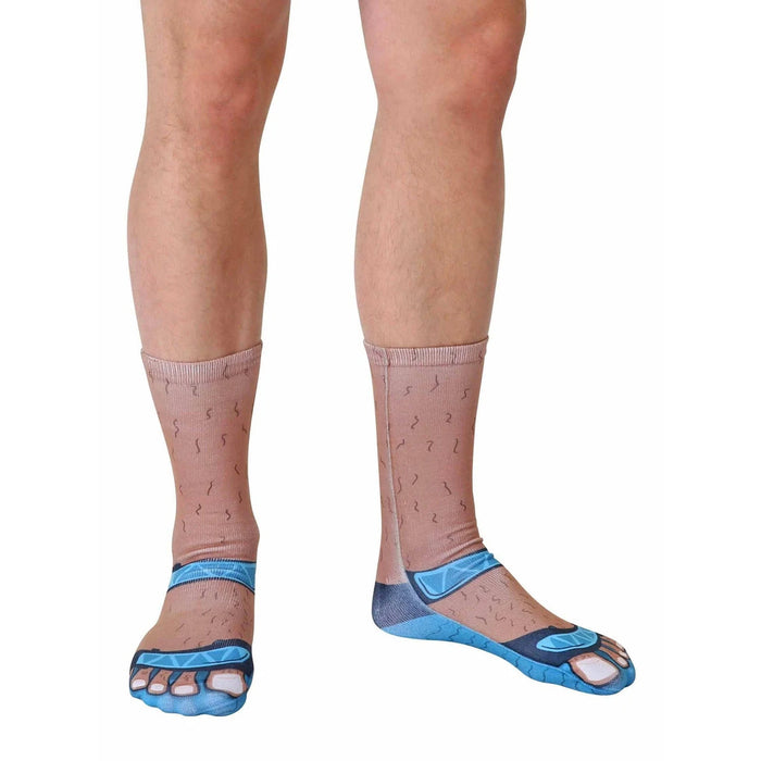 A pair of socks printed with an image of hairy feet wearing blue flip-flops.