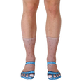 Close-up of a pair of novelty socks; tan-colored with hairy legs and light blue sandal designs on the toes. [lf]
