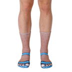 Close-up of a pair of novelty socks; tan-colored with hairy legs and light blue sandal designs on the toes. [lf]