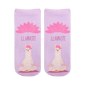 A pair of lavender ankle socks with a meditating llama and pink lotus flower. The socks feature the text "LLAMASTE" and showcase a cute, whimsical design.