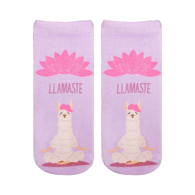 A pair of lavender ankle socks with a meditating llama and pink lotus flower. The socks feature the text "LLAMASTE" and showcase a cute, whimsical design.