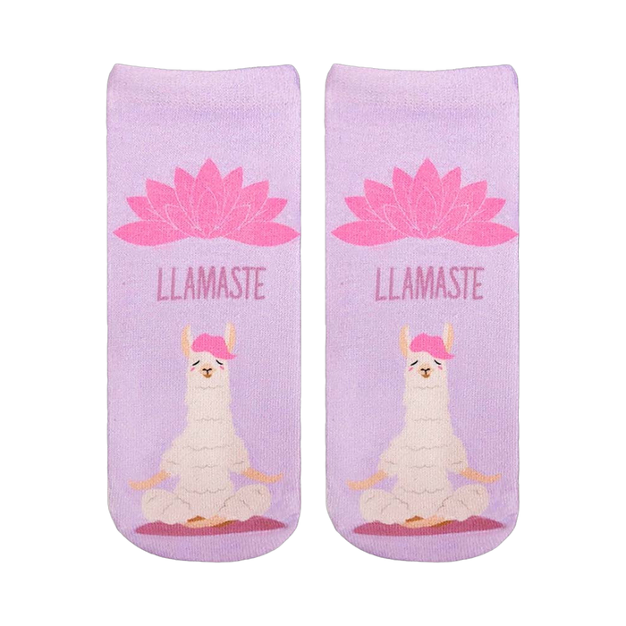 A pair of lavender ankle socks with a meditating llama and pink lotus flower. The socks feature the text 