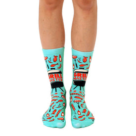 blue grilling-themed crew socks for men and women featuring spatulas, tongs, hot dogs, hamburgers, steaks, fish, and flames.  