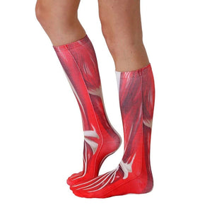 A pair of socks with a red and white muscle pattern.