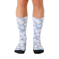 Crew socks with a light blue background and a repeating pattern of gray volleyballs.  Black reinforced toe and heel. [lf]