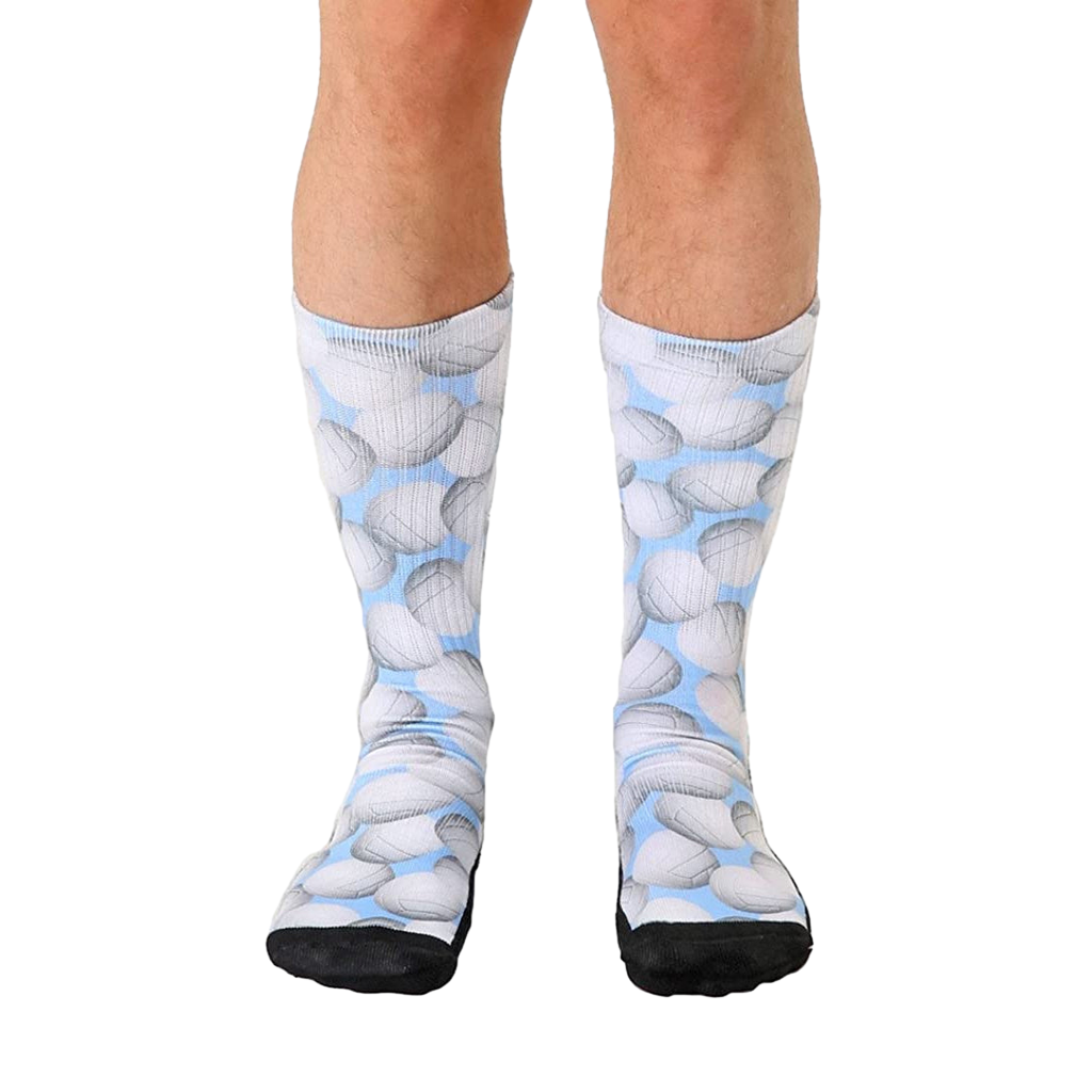 Crew socks with a light blue background and a repeating pattern of gray volleyballs.  Black reinforced toe and heel. [lf]