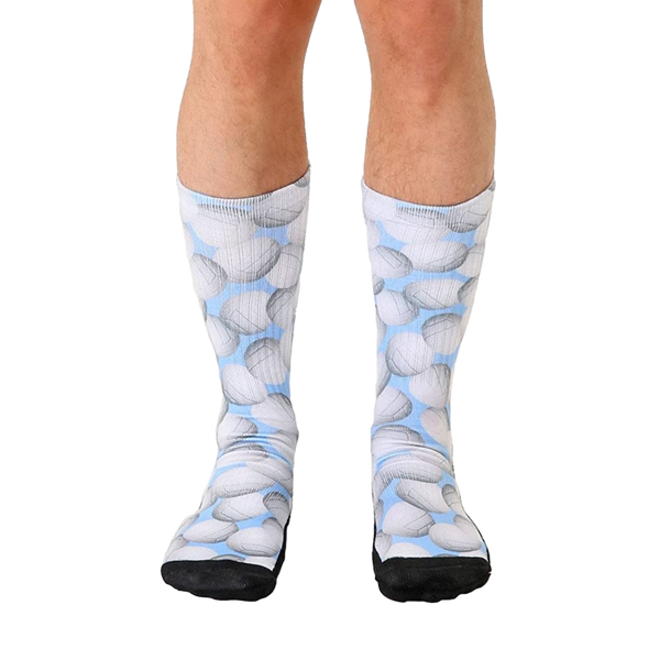 Crew socks with a light blue background and a repeating pattern of gray volleyballs.  Black reinforced toe and heel. [lf]