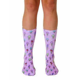 purple crew socks with cartoon ice cream cone pattern and rainbow sprinkles. fun and playful socks.   