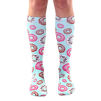 Pair of pastel blue knee-high socks adorned with a pattern of pink and chocolate donut illustrations. [lf]