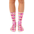 Pair of crew socks with a pink donut pattern on a pastel blue background. Fun and quirky style! [lf]