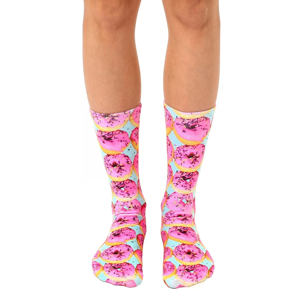 Pair of crew socks with a pink donut pattern on a pastel blue background. Fun and quirky style! [lf]