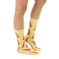 Lifestyle shot showing the hot sauce socks on a person's feet.  The socks are styled with a casual outfit. [lf]