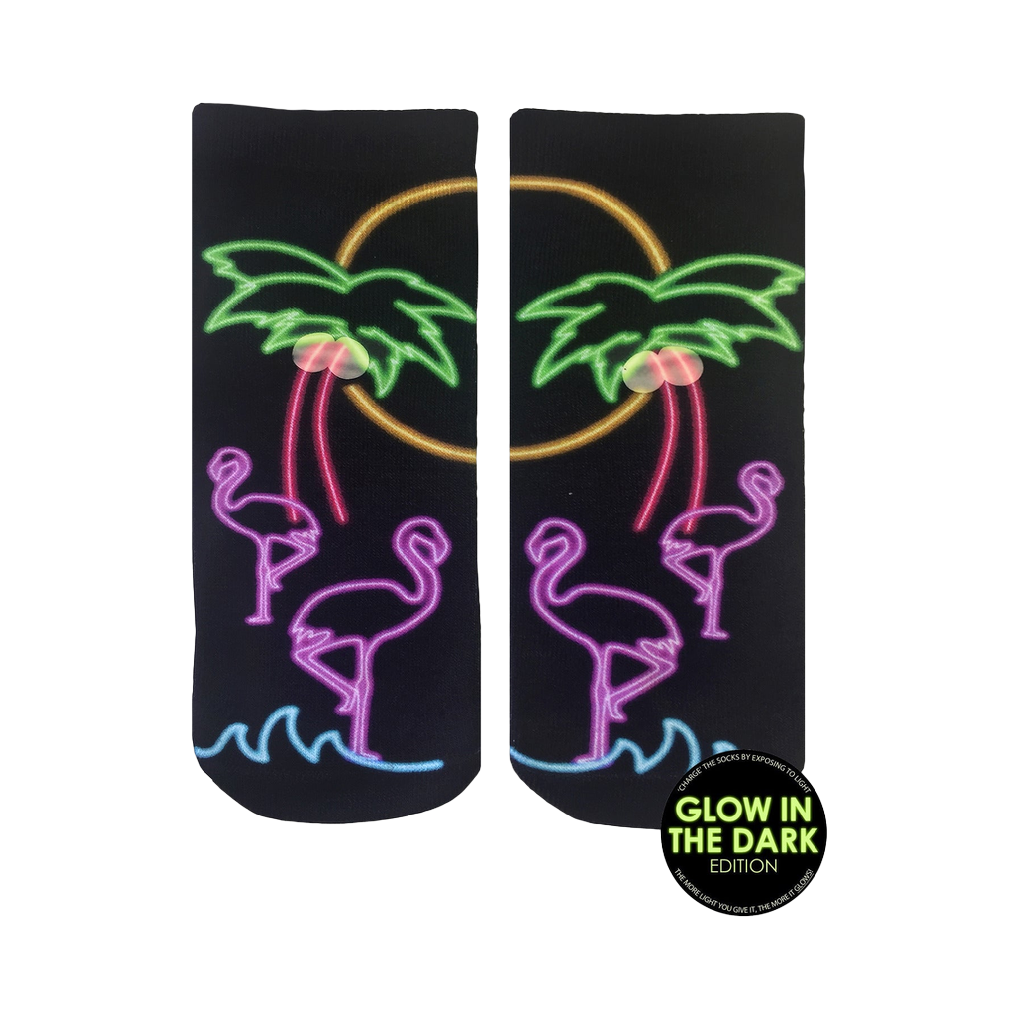 Pair of black ankle socks with a neon glow-in-the-dark design. Flamingos, palm trees, and a sunset are depicted in pink, purple, and green.