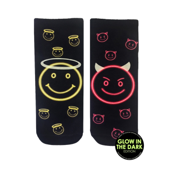 Pair of black crew socks with a glow-in-the-dark design. One sock features a neon yellow angel smiley face, the other a neon pink devil smiley face.