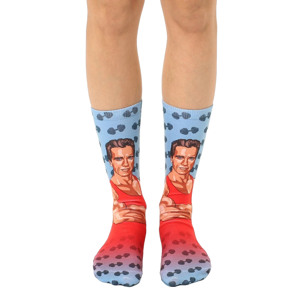 Crew socks featuring Arnold Schwarzenegger's image in red and blue, with dumbbell pattern. [lf]