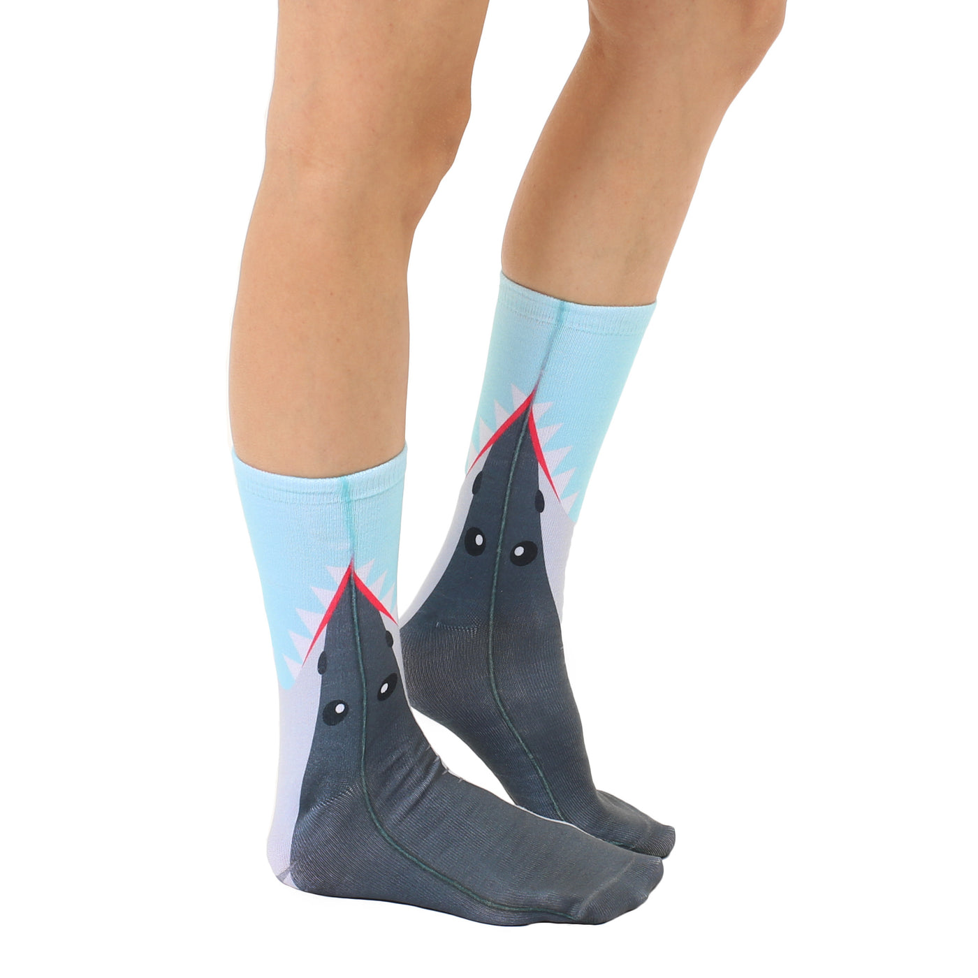 Lifestyle shot showing a person wearing the Shark Bite socks. The socks are positioned to show the shark design effectively. [lf]