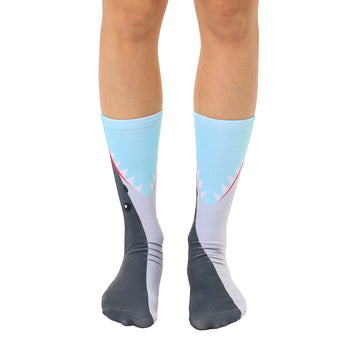 Crew socks featuring a light blue and gray shark design. The shark's mouth is depicted at the top of the sock.