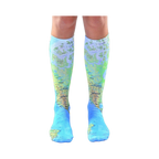 Pair of light blue knee-high socks with a detailed world map design.  The map features green and brown landmasses and blue oceans.