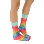 Lifestyle shot of Rainbow Pancake socks on a person's feet, showing the socks from the side. [lf]