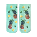 Pair of mint green ankle socks with a fun pattern of googly-eyed pineapples and pineapple slices.