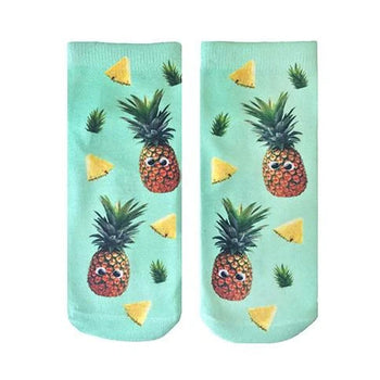 light green ankle socks with googly-eyed cartoon pineapples and pineapple slices.  