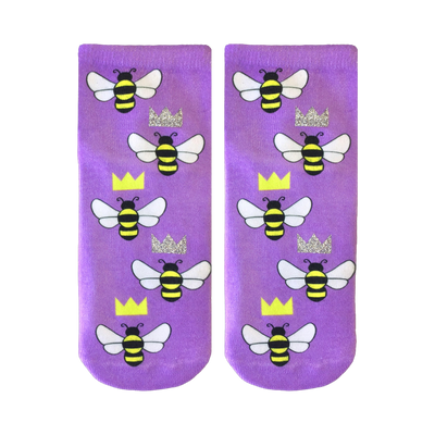 Pair of lavender ankle socks adorned with a repeating pattern of cartoon bees and glitter crowns. 