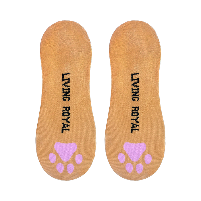 Close-up view of the soles of the Kitty socks, displaying 'Living Royal' text and pink paw prints.