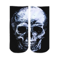 Ankle socks in black and white featuring a detailed skull graphic. The skull is sketched in shades of gray and white against a black background.