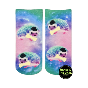 Ankle socks featuring a pastel galaxy print and multiple images of hedgehogs wearing top hats and bow ties. The hedgehogs appear to glow in the dark.