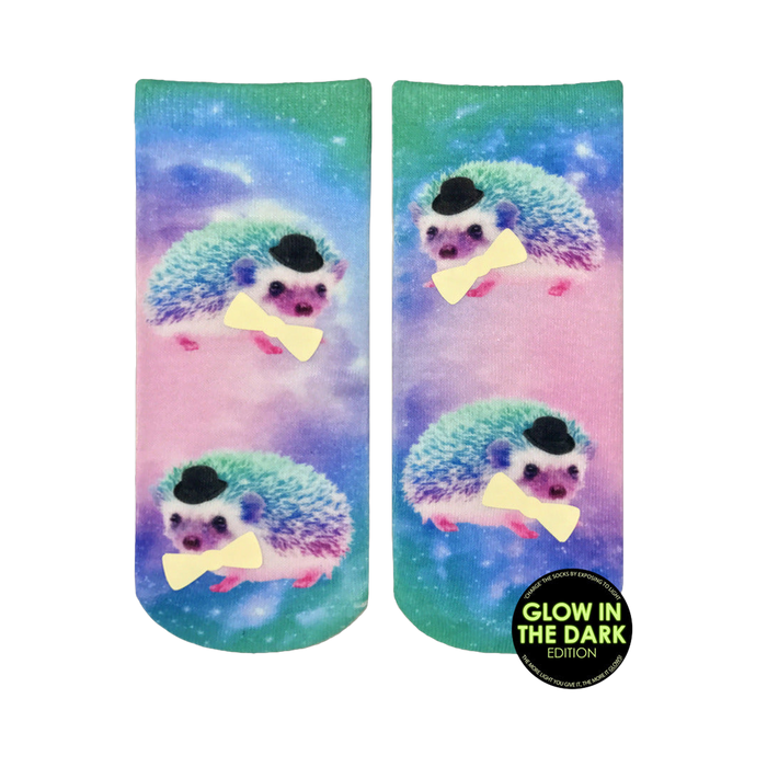 Ankle socks featuring a pastel galaxy print and multiple images of hedgehogs wearing top hats and bow ties. The hedgehogs appear to glow in the dark.
