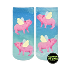 Lifestyle shot of the 'When Pigs Fly Glow' socks on a person's feet. The glow-in-the-dark detail is subtly visible.