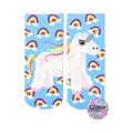 Crew socks with a fluffy unicorn and rainbows on a light blue background. Glitter accents on the unicorn's horn.