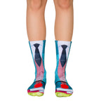 A pair of crew socks with a teacher-themed design: teal, blue, and red, showing a tie, books, and an apple. [lf]