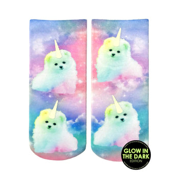 blue and purple tie-dye socks adorned with a white unicorn puppy with rainbow horn and tail. ankle length, for women. glow in the dark.   