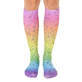 knee-high rainbow socks with peace signs, hearts, stars, flowers, smiley faces, and rainbows. fun and funky socks for women.  