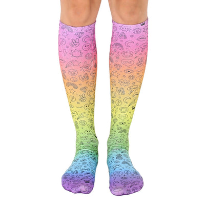 knee-high rainbow socks with peace signs, hearts, stars, flowers, smiley faces, and rainbows. fun and funky socks for women.  